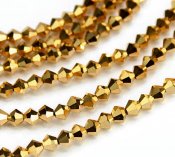 bicone-guld-glaspärlor-4mm.jpg